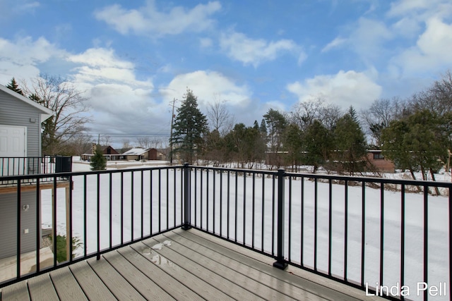 view of snow covered deck