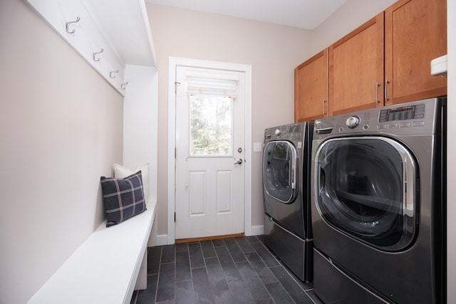 laundry area featuring cabinets and washing machine and clothes dryer