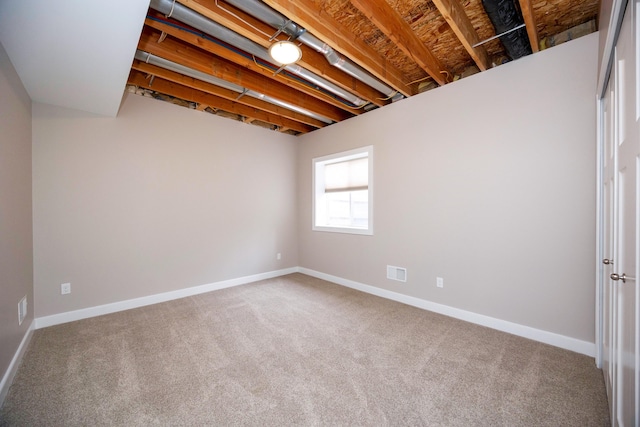 basement with carpet flooring