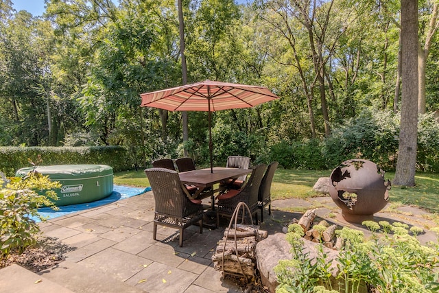 view of patio with a hot tub