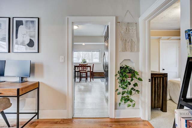 hallway with wood finished floors