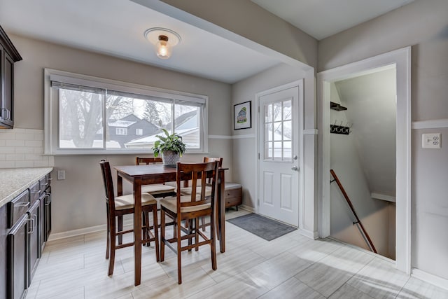 dining space featuring baseboards