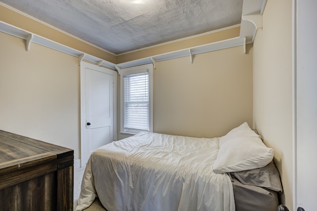 bedroom featuring a textured ceiling