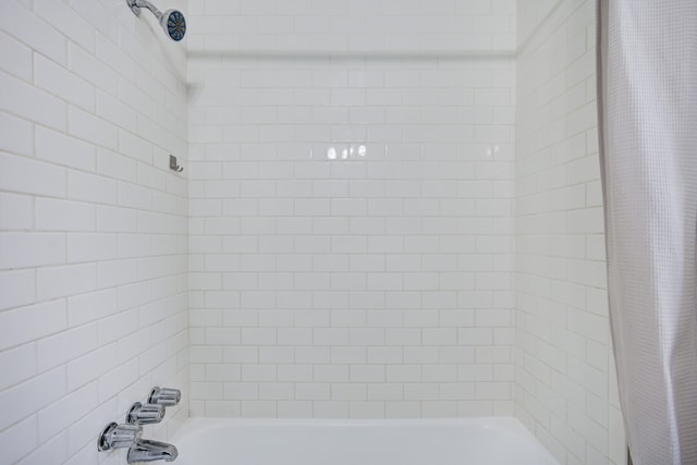 bathroom featuring shower / bath combination with curtain