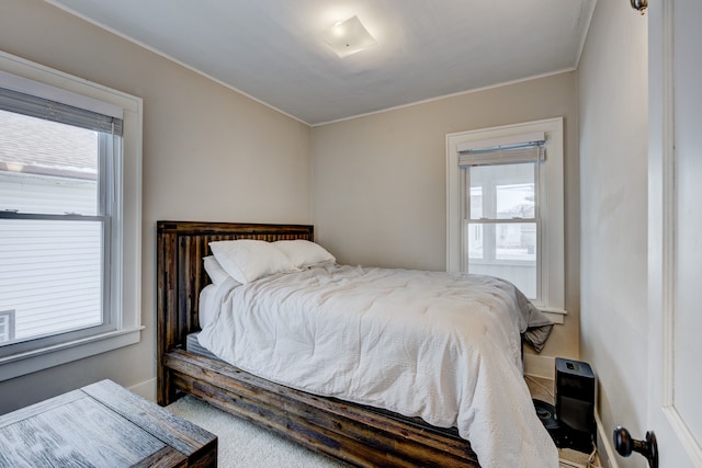 bedroom with multiple windows