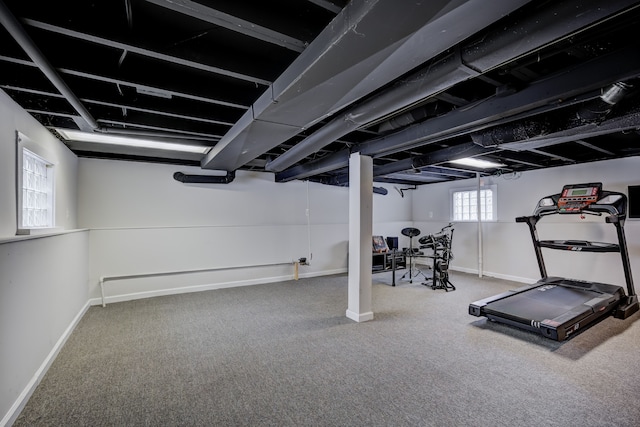 workout area with carpet flooring and baseboards