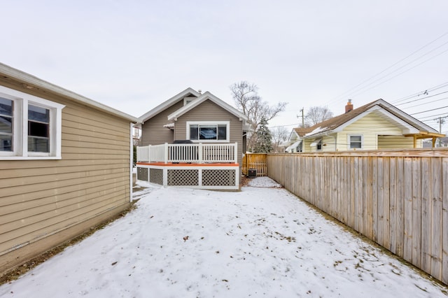 exterior space featuring fence and a wooden deck