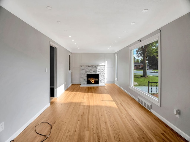 unfurnished living room with light hardwood / wood-style flooring