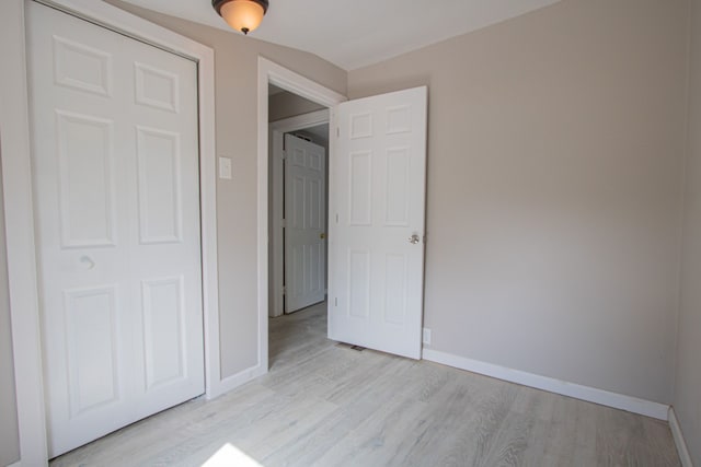 unfurnished bedroom with light wood-type flooring