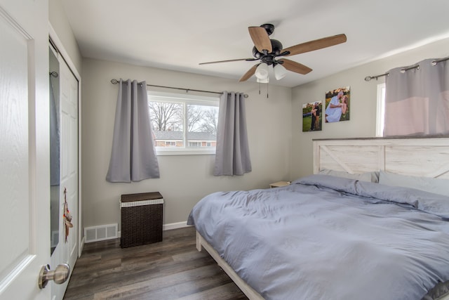 bedroom featuring dark hardwood / wood-style floors and ceiling fan