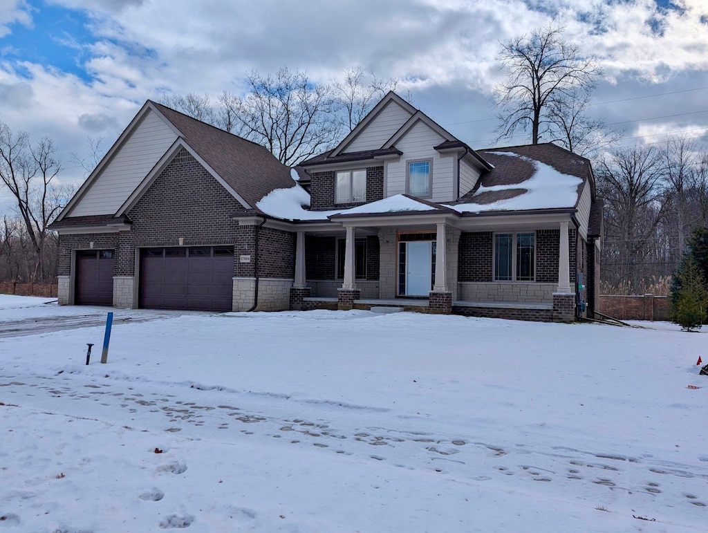 view of front of home featuring a garage and covered porch