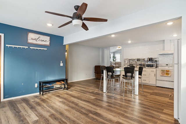 dining room with dark hardwood / wood-style floors