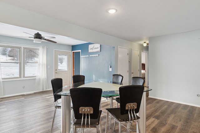 dining space featuring dark hardwood / wood-style floors and ceiling fan