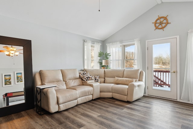 living room with wood-type flooring, high vaulted ceiling, and ceiling fan