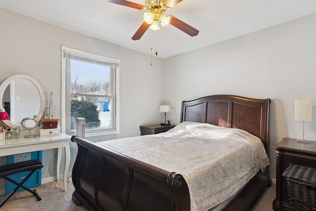 bedroom featuring ceiling fan and carpet