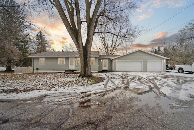 single story home with a garage