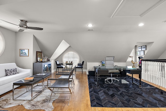 home office with lofted ceiling, hardwood / wood-style floors, and ceiling fan