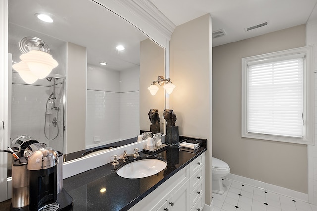 bathroom with walk in shower, vanity, and toilet