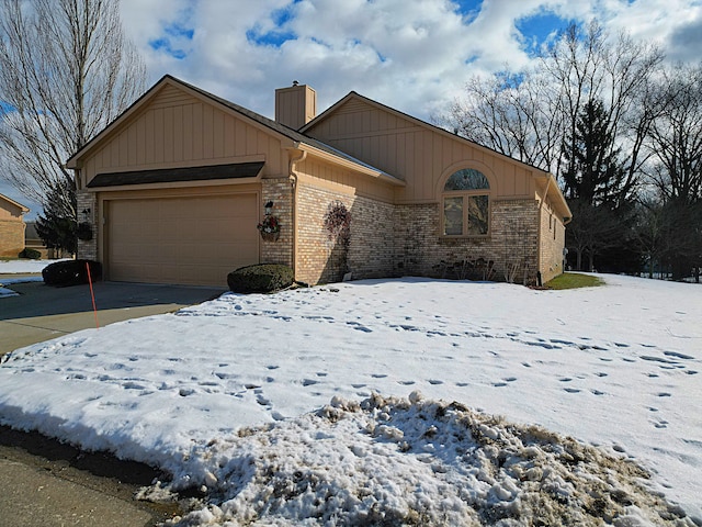 ranch-style house featuring a garage