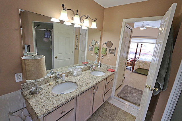 bathroom featuring vanity, tile patterned floors, a chandelier, and walk in shower