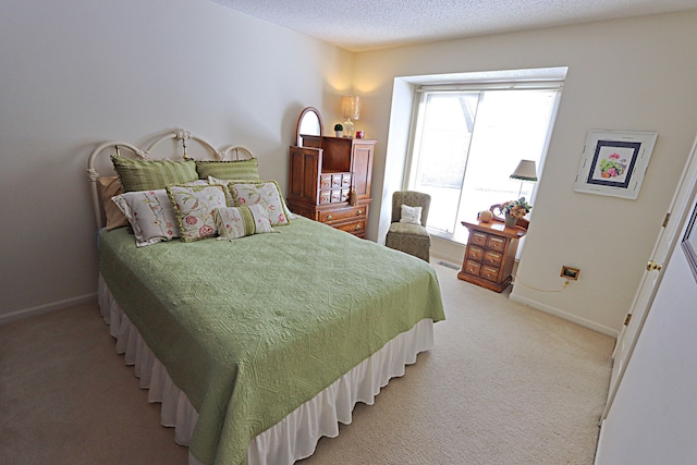 bedroom with carpet flooring and a textured ceiling