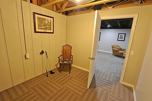 sitting room featuring carpet flooring