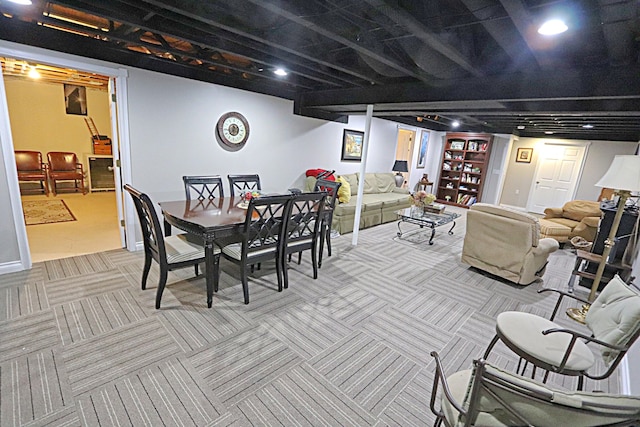 dining area featuring light carpet