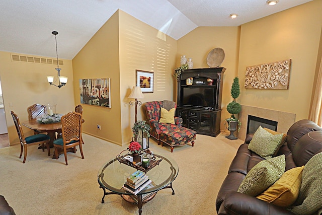 living room with an inviting chandelier, vaulted ceiling, and light carpet