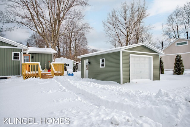 view of snow covered garage