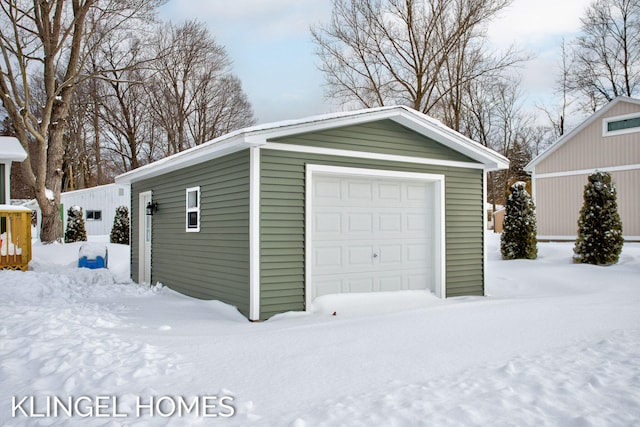 view of snow covered garage