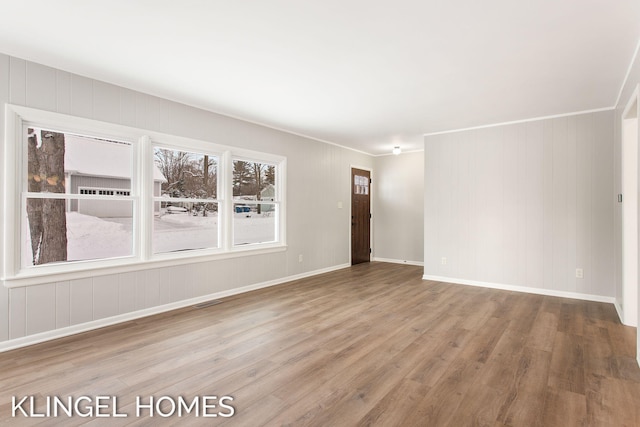 unfurnished room with hardwood / wood-style floors