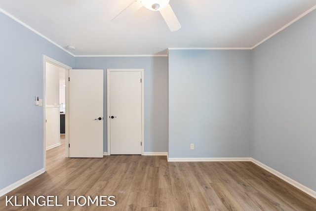 unfurnished bedroom featuring ornamental molding, ceiling fan, and light hardwood / wood-style flooring