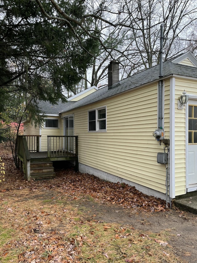 view of home's exterior featuring a deck