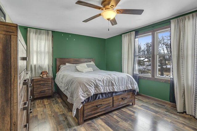 bedroom featuring dark hardwood / wood-style flooring and ceiling fan