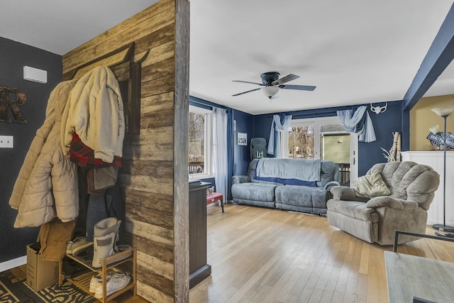 living room featuring ceiling fan and light wood-type flooring