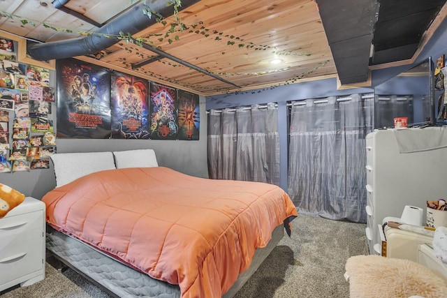 bedroom featuring carpet floors and wooden ceiling