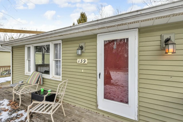 entrance to property featuring a deck