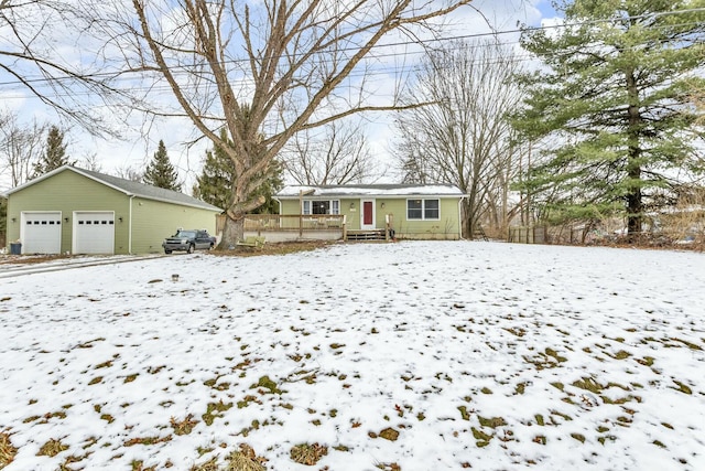 view of front of home with an outbuilding, a garage, and covered porch