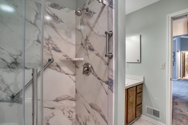 bathroom featuring vanity and an enclosed shower