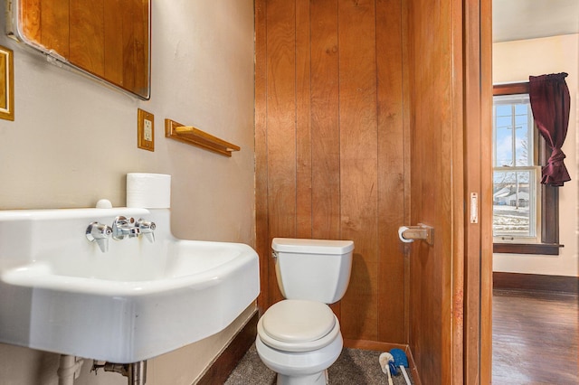 bathroom featuring hardwood / wood-style flooring, sink, and toilet