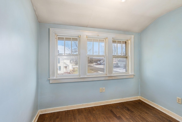 unfurnished room featuring hardwood / wood-style flooring and plenty of natural light