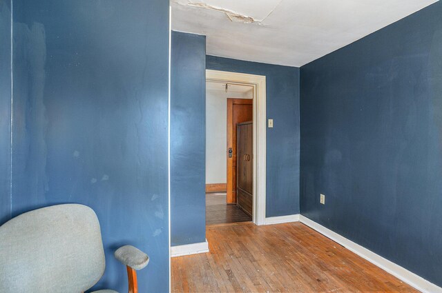 spare room with wood-type flooring