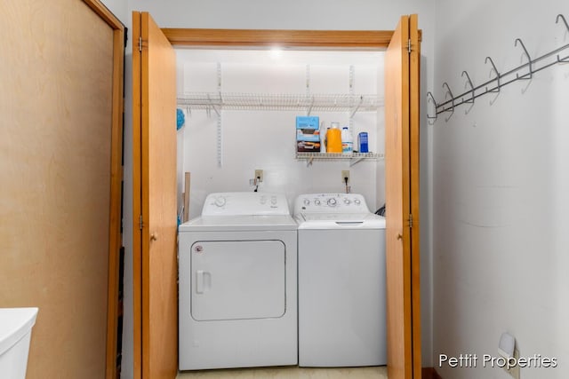 washroom with washer and dryer