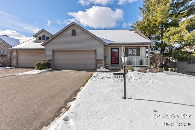 ranch-style house with a garage and covered porch