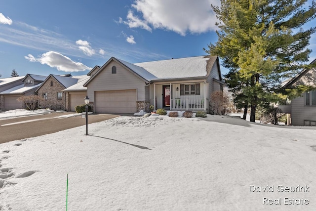 single story home featuring a garage and a porch