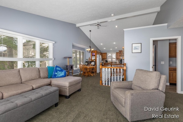 carpeted living area with lofted ceiling with beams and ceiling fan with notable chandelier