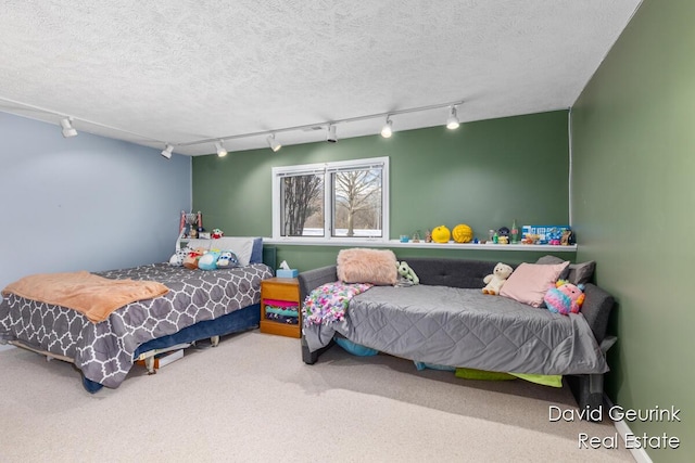 carpeted bedroom with a textured ceiling