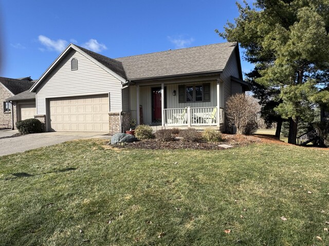 ranch-style house with covered porch, a garage, a shingled roof, driveway, and a front lawn