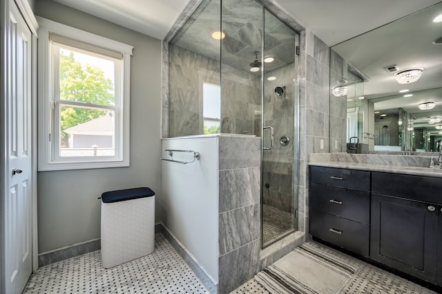 bathroom with vanity and an enclosed shower