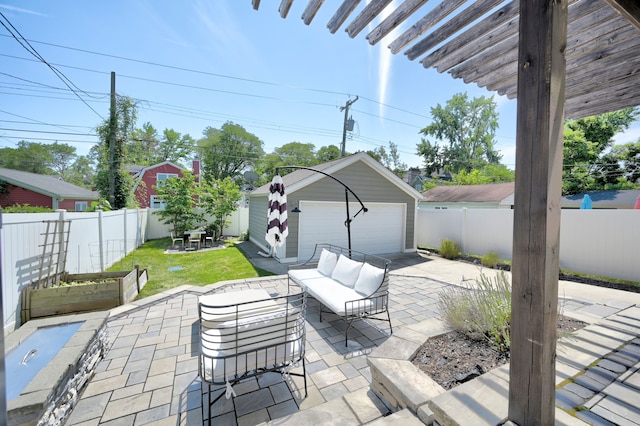 view of patio with a garage, an outdoor structure, and an outdoor living space